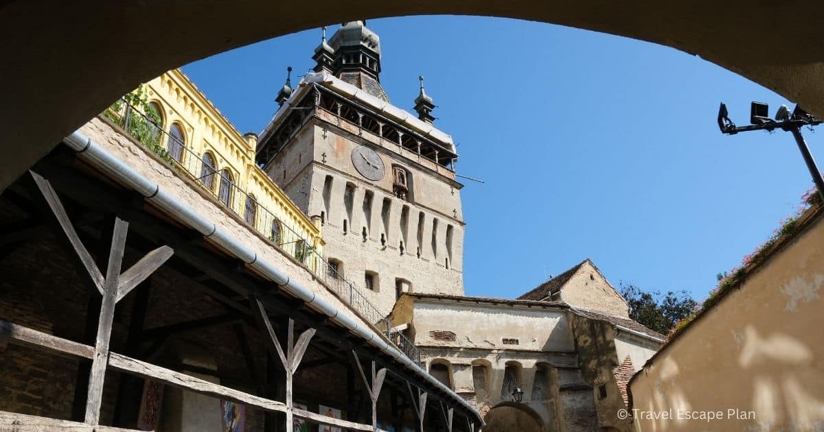 View of the medieval Clock Tower in Sibiu through an archway