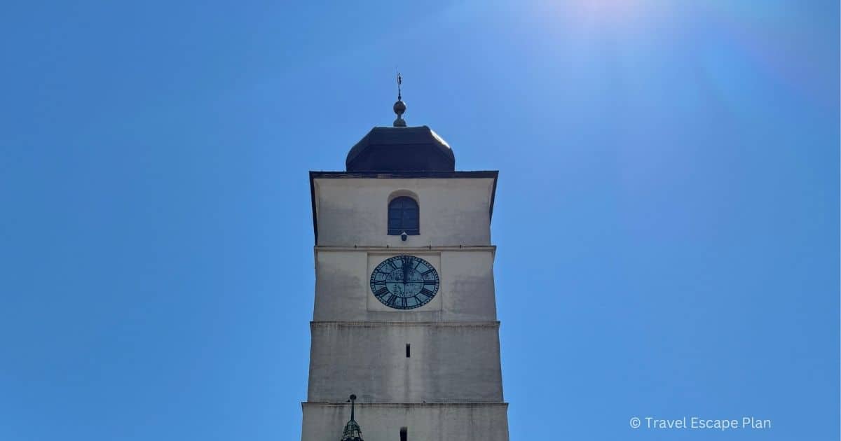 Sibiu's Council Tower and its clock in front of a clear blue sky