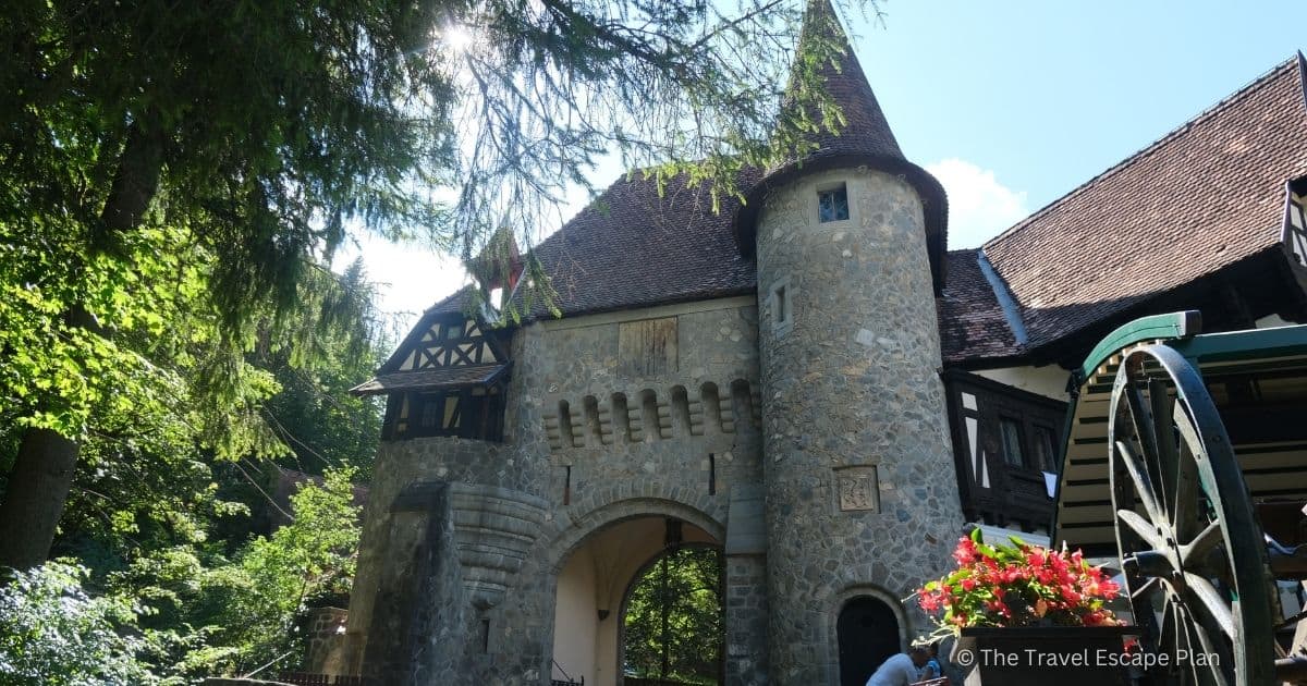 Medieval fairytale-like stone gate with turrets from Sinaia, Romania