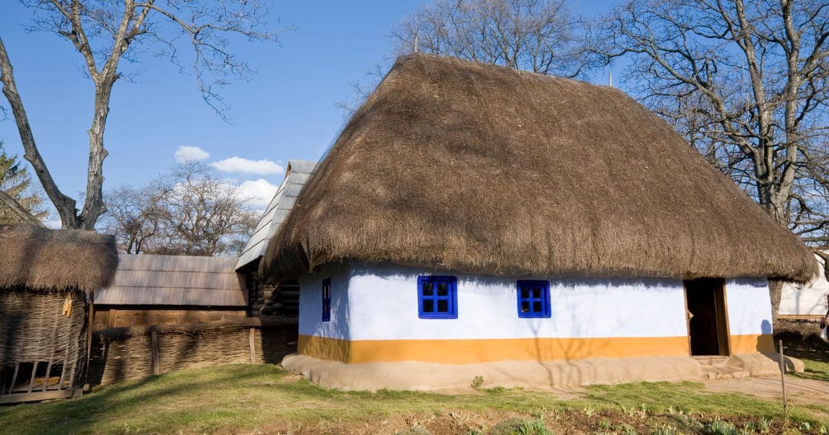 house with straw rooftop from open air museum in Bucharest