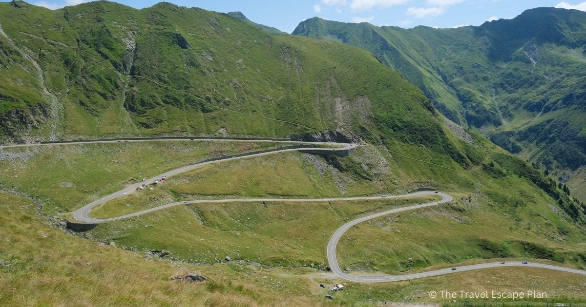 the Transfagarasan highway zig zagging through the green Fagaras Mountains in Romania