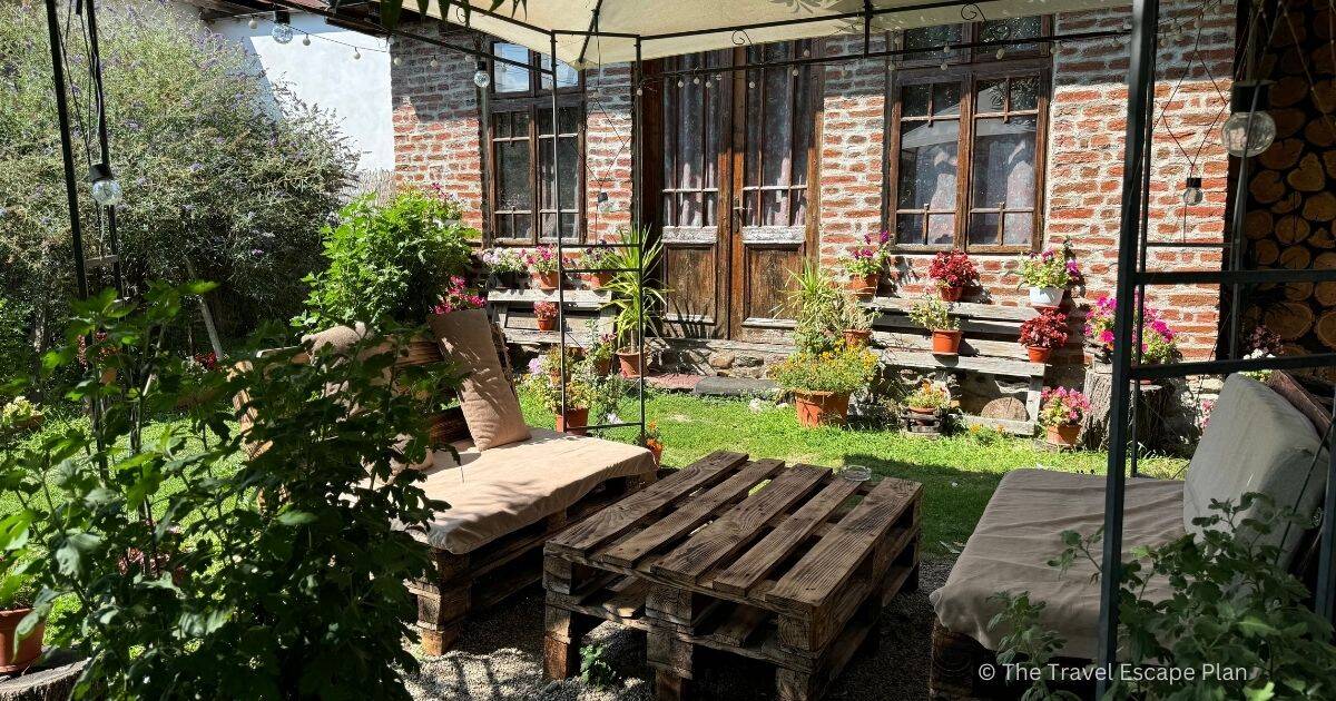 outdoor table setting in front of a cosy cabin, Curtea de Arges, Romania